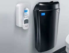 black feminine waste bin and a white air freshener