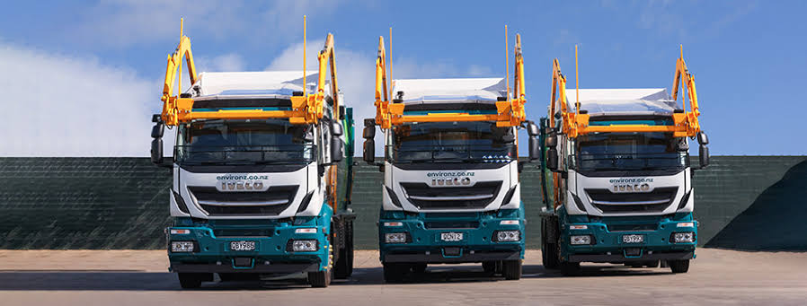 Three Enviro NZ collection trucks lined up together